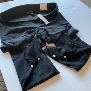 NWT black leggings with pearls at bottom.